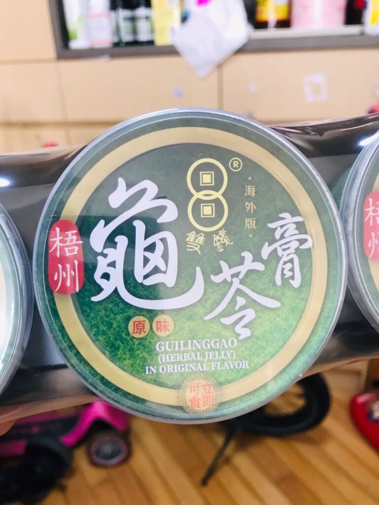 雙錢牌龜苓膏手拍照